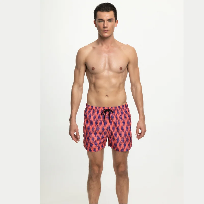 Prepárate para deslumbrar en la playa o la piscina con el Bañador Bermuda Waves Coral de Ungaro